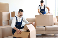 Movers unpacking boxes in a home